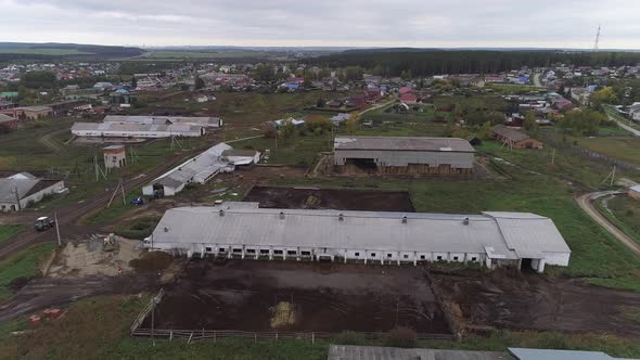 Aerial view of a farm in village with many cowsheds 05 alt