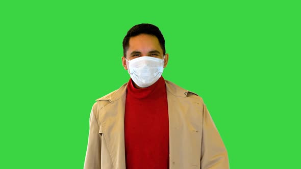 Latin Man Happy Smiling Under Protective Medical Face Mask for Covid Prevention Walking Wear Trench