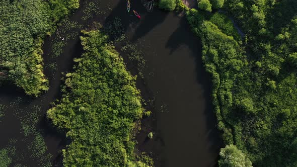 Top View of the Svisloch River Kayakers Floating on the River in the City's Loshitsky Park at Sunset alt