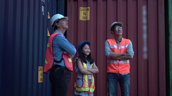 Happy Family crossed arms at container cargo, Father daughter and senior engineer in shipyard