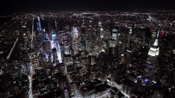 Wide angle view of the Empire State Building at Night as seen from a helicopter