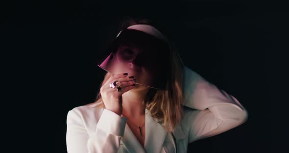 Woman in White Trendy Blazer Closing Her Face By Modern COVID 19 Face Shield alt