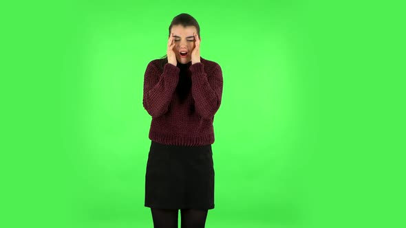 Woman Suffering From Headache From Fatigue. Green Screen alt