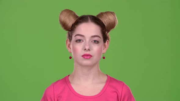 Teen Begins To Smile at the Camera. alt