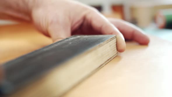 Finishing operation, polishing the cutter on the skin. Sharpening a chisel on a bar with an abrasive alt