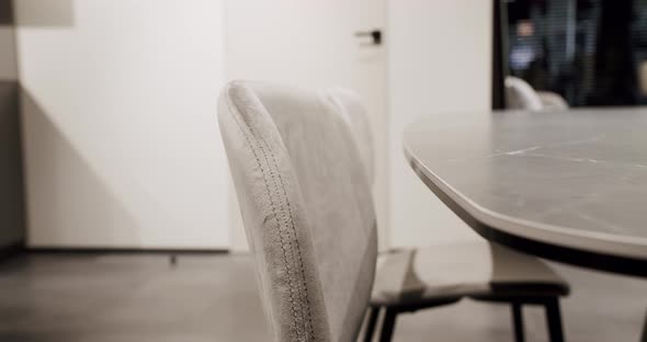 Leather Modern Gray Chair in Living Room with Kitchen and Dining Table alt