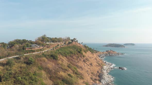 Seaside road along the coastline of Phuket. Tropical sea aerial view alt
