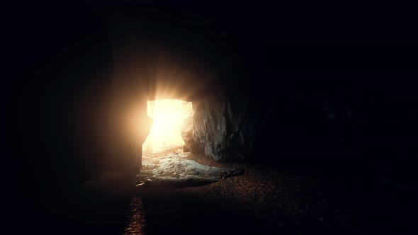 Breathtaking Scenery of Bright Sun Rays Falling Inside a Cave Illuminating alt