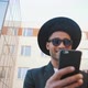 Young Handsome American African Man Using Smartphone on Urban Background - VideoHive Item for Sale