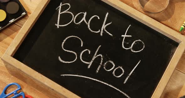 Close-up of chalkboard with colored pencil and crayon alt