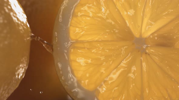 Rolling Half of Fresh Lemon and Opening the Inside of the Fruit in Slow Motion alt