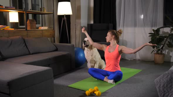 Relaxed Female with Dog Practicing Yoga Lotus Pose alt