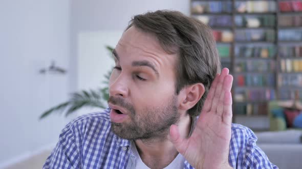Man Listening Secret Carefully in Office Library alt