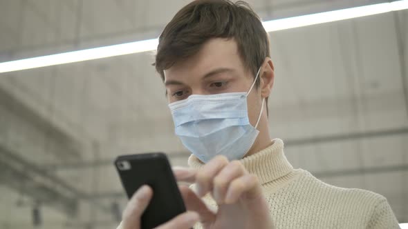 Man Protective Mask Rubber Gloves Uses Smartphone Communicate Work in Supermarket alt