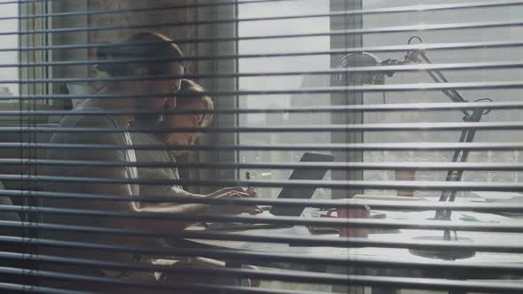 Friends are Working Together on a Common Project Smiling and Laughing alt