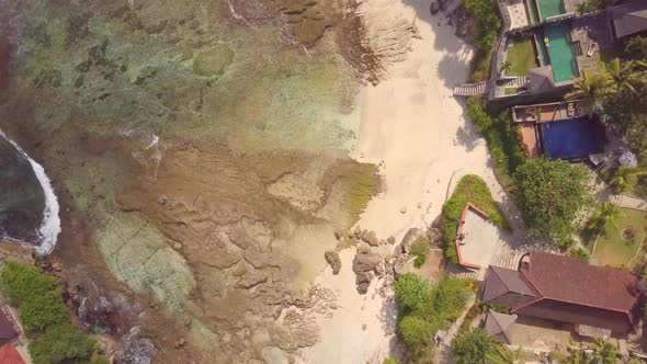 Aerial drone view of the beach at Mahana Point, Bali, Indonesia. alt