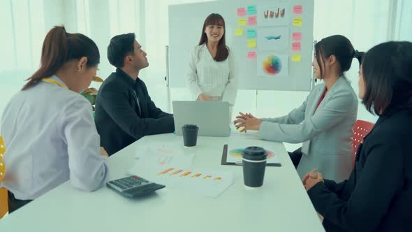 Business People Proficiently Celebrate Project Success at Office Workplace alt