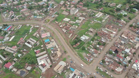 Aerial top down on street traffic residential district of Loitokitok town, Kenya alt