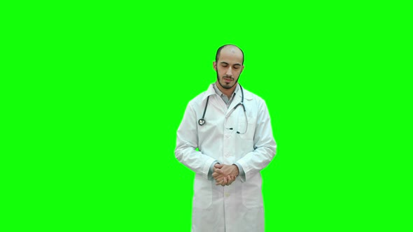 Serious Male Doctor Talking To the Camera on a Green Screen, Chroma Key alt