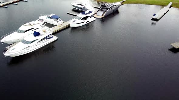 Yacht marina with motor boats alt