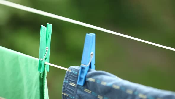 Clothes Hanging to Dry on Laundry Line. alt