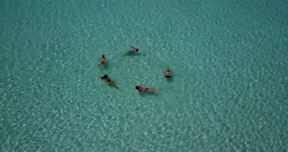 Beautiful happy ladies on vacation enjoying life at the beach on summer ...