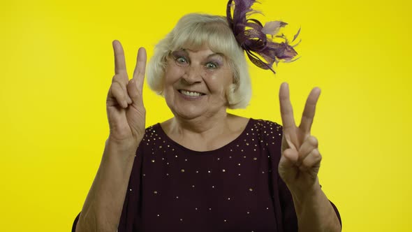 V Sign, Peace. Happy Senior Old Woman Showing Victory Sign with Double Fingers and Smiling alt