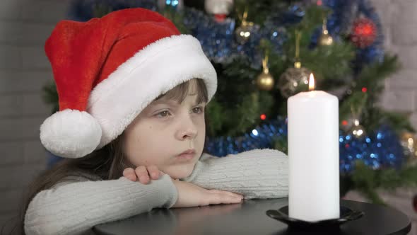 Festive Moment with Burning Candle at Christmas alt