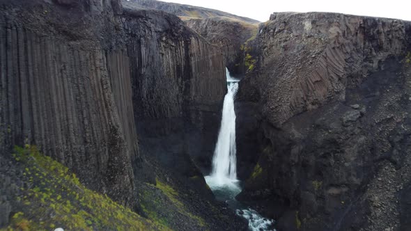 Approaching Flight to Basaltic Waterfall in Iceland