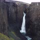 Approaching Flight to Basaltic Waterfall in Iceland - VideoHive Item for Sale