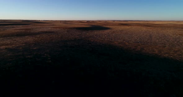 An ascending flight during sunset to show the vastness of the North American Great Plains alt