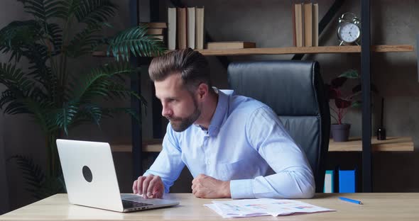Excited Business Man Checking Email Reading Great News on Laptop alt