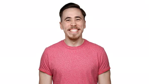 Portrait of Positive Man with Hazel Eyes Laughing and Expressing Happiness Isolated Over White alt