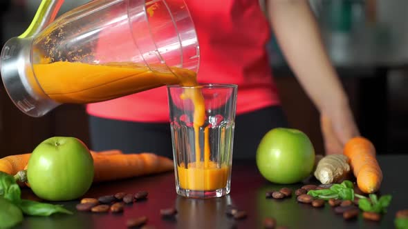 Pouring Smoothie From Blender Into Glass alt