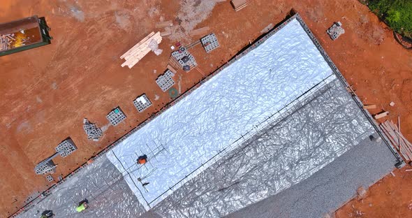 A Barrier Plastic Barrier is Installed Before Concrete is Poured Into the Foundation of a Structure alt