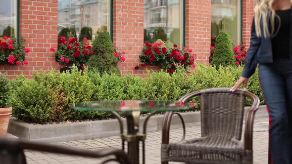 Fashionable Woman Sitting Down in the Cafe.