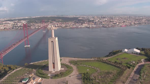 Aerial of Christ the King statue near 25 de Abril Bridge