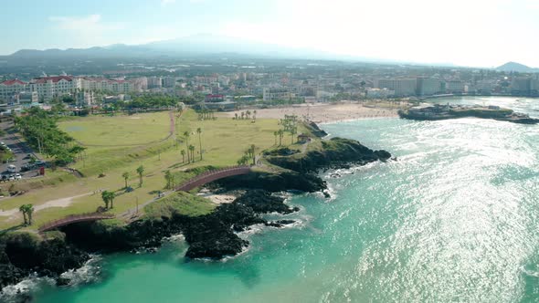 Drone photographed the beach of a summer resort. Jeju Island Hamdeok Beach.