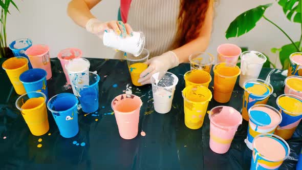 An Artist is Mixing Acrylic Colors