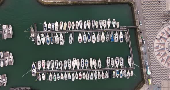 Drone top view shot of Lisbon by Boat, a Boat renting place at Rose Compass and Padrao Dos Descobrim alt