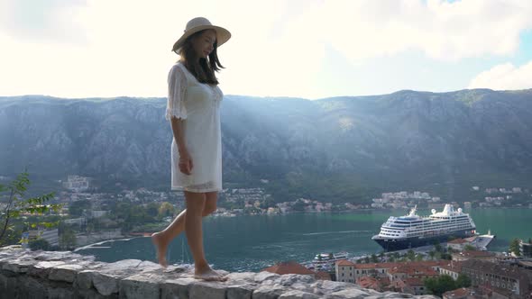 Girl Walking Along the Parapet at the Fortress Above Kotor
