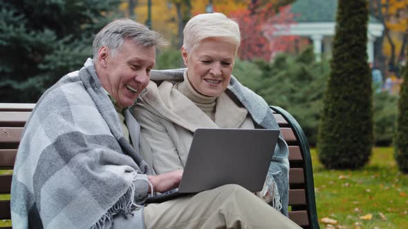 Older Happy Caucasian Husband Wife Mature Elderly Couple Grandparents Family Look at Screen Laptop alt