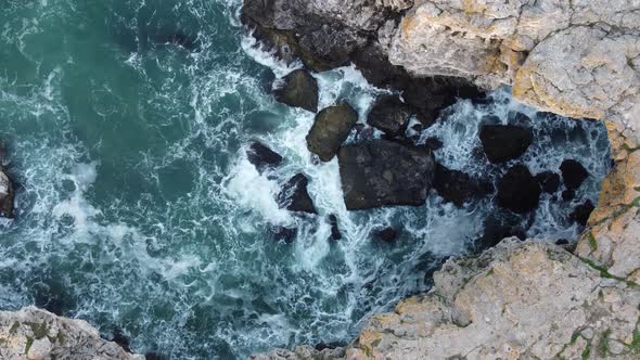 Aerial View of Sea Waves and Fantastic Cliffs Rocky Coast alt