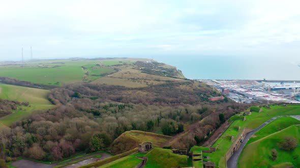 Drone shot over dover castle towards white cliffs and port alt