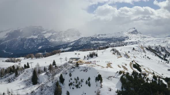 Aerial, Snowy Dolomites Mountains, Chair Lift And Mountain Hut 