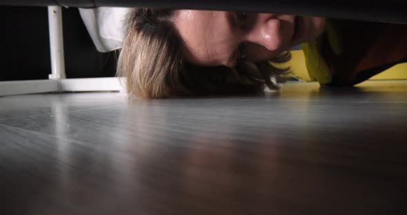 Cleaning Lady Taking Out Black Men Sock From Under Sofa  Movie Slow Motion alt