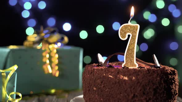Birthday Cake Golden Candle Number 7 Seventh Fire From Lighter Blowing Out Candles alt
