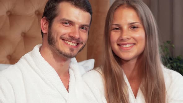 Cheerful Couple Showing Heart Sign with Their Hands alt