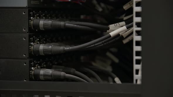 Cables and Optical Fiber Cable Connectors Plugged Into Large Data Center Server