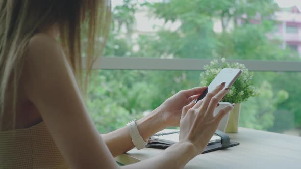 Young Asian Woman Enjoying A Relaxing Moment in the Coffeeshop 02 alt
